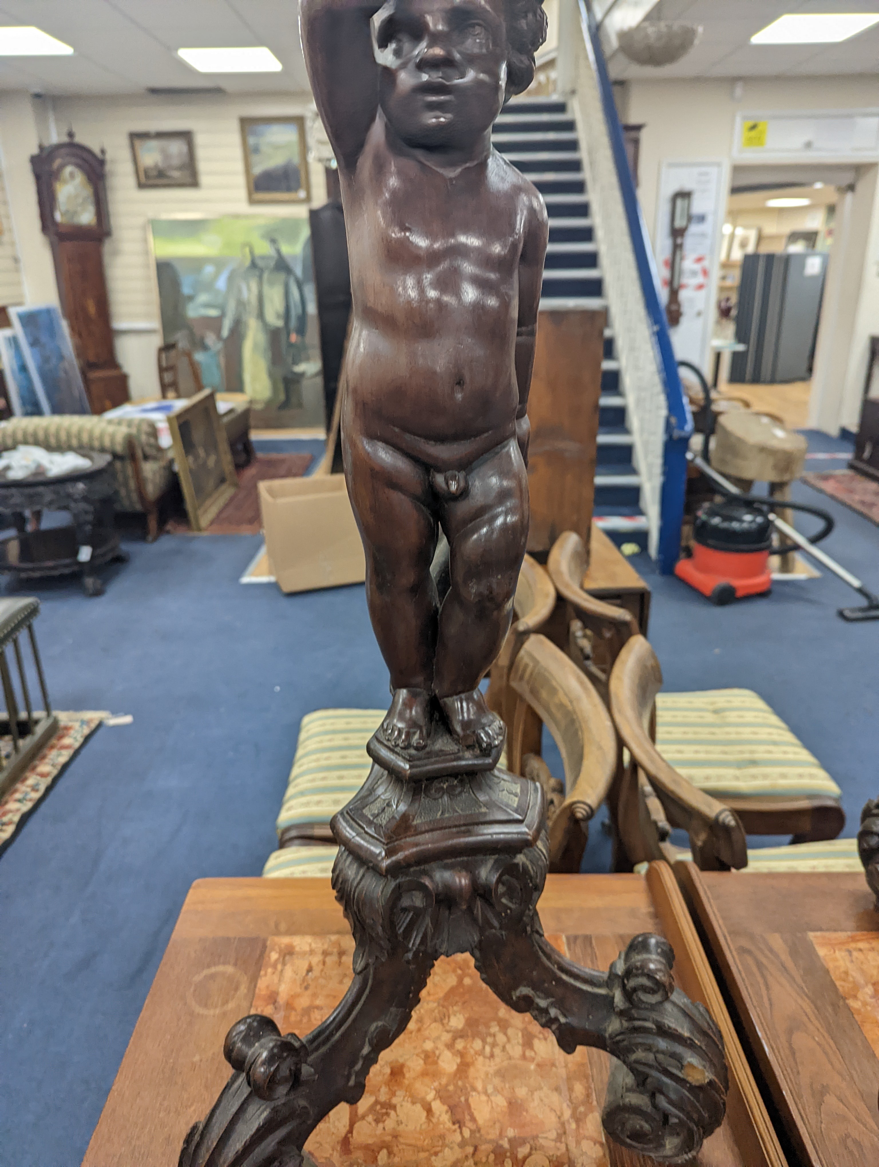 A pair of 18th century style Italian carved walnut figural torcheres with cherub stems, height 96cm